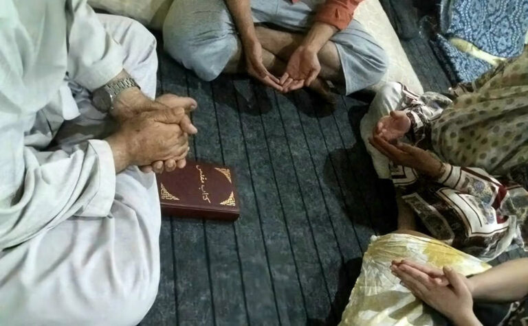 Afghans praying